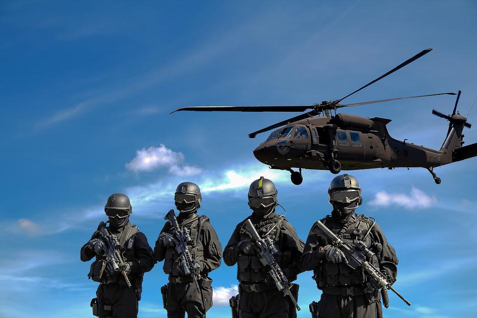 image of helicopter and soldiers